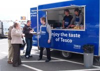 people outside burger van